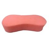 Pink oval-shaped equi-sential expanding sponge with soft porous texture for grooming horses in equestrian care