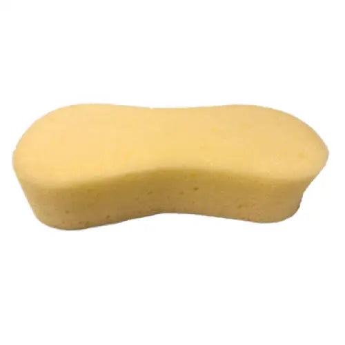 A pale yellow equi-sential expanding sponge with a curved top edge and porous texture for equestrian use on horses
