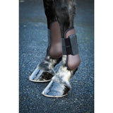 Brown leather equi-sential tendon boots with black elastic straps for equestrian horse protection