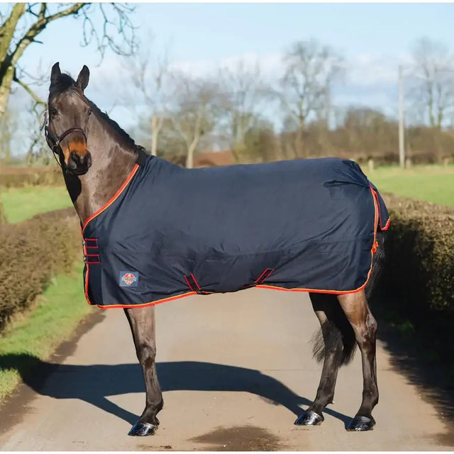 Dark navy turnout rug light with orange trim red buckle cross belly and fleece wither for horses by equi-sential