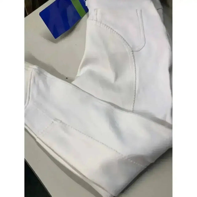 White equi theme suedette seat competition breeches featuring classic five-pocket design and visible stitching