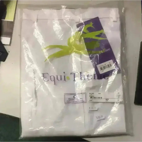 White equi theme ladies breeches velcro bottoms neatly folded in clear plastic with lime green ribbon packaging