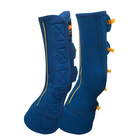 Blue quilted close contact chaps with yellow zipper and strap accents for mud fever prevention by equilibrium equi-chaps close