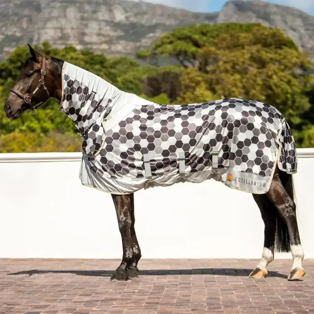 A sleek breathable equilibrium field relief fly rug in gray with a modern hexagonal pattern for field use