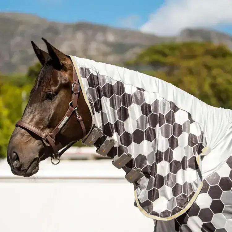 A sleek black and white hexagonal patterned equilibrium field relief fly rug with a glossy reflective finish