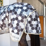 A sleek equilibrium field relief fly rug in grey with a modern geometric hexagon pattern for field use