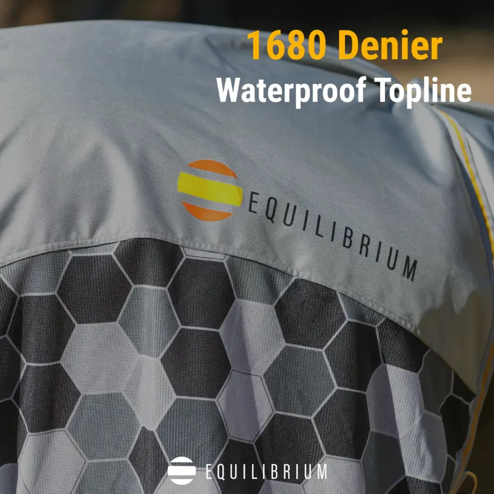 Gray 1680 denier waterproof top-line jacket with hex pattern and equilibrium logo for equilibrium field relief fly rug