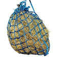 Blue woven netting bag filled with golden hay for equilibrium portionpacer 6cm haynet steady feeder use