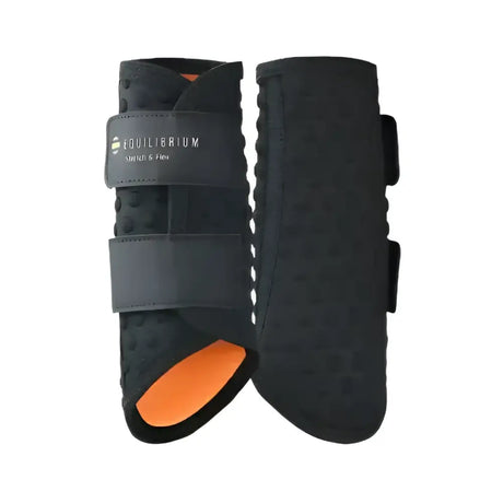 Black equilibrium stretch and flex flatwork wraps with breathable material and orange interior lining for horse legs