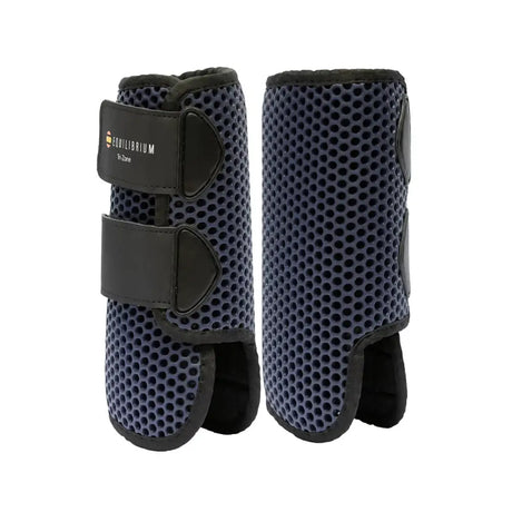 Navy blue perforated equilibrium tri-zone horse leg guards with black straps and branded patch perfect all-rounder boots