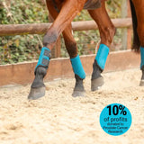 Bright blue mesh equilibrium tri-zone brushing boots with black adjustable straps for horse legs in black royal blue