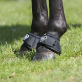 Black equilibrium tri-zone reach boots with white logo strap showing back side tested for overreach protection
