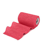 A roll of vibrant pink textured equimed 10cm vetwrap single elastic wrap with a woven fabric surface