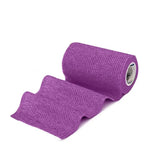 A roll of purple textured equimed 10cm vetwrap single elastic wrap with a woven fabric surface for secure veterinary use