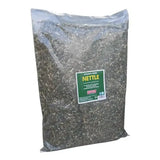 A clear bag of dried green equimins nettles natural herb labeled nettle with bold yellow text on green background