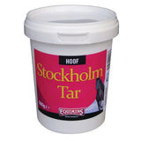 White plastic bucket of equimins stockholm tar pine tar with pink label yellow text and black horse image