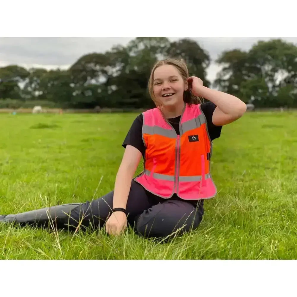 Equisafety hi viz multi colour waistcoat in bright orange and pink with reflective stripes and breathable mesh hi-vis material