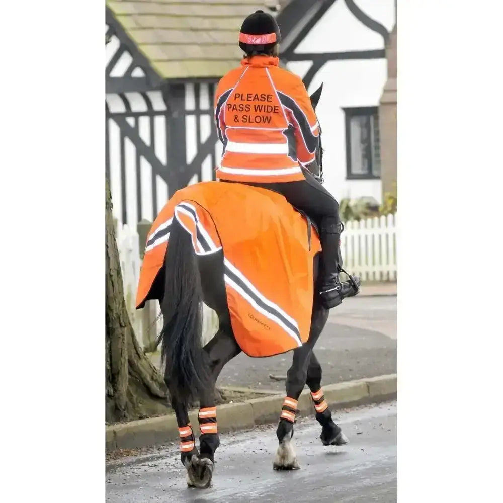 Bright orange reflective wraparound winter exercise rug with black and white stripes and please pass wide slow text on back made from performance fabric