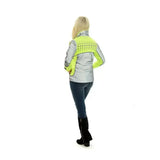 A woman wearing the back of an equisafety mercury lightweight reflective riding coat in silver and neon yellow with dotted pattern