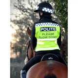 A bright neon yellow equisafety polite hi vis waistcoat with black lettering and reflective stripes worn over dark uniform