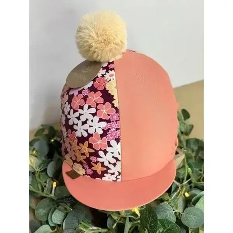 A coral terracotta hat cover with equisilks spring floral ditsy floral design and a beige pom-pom on top