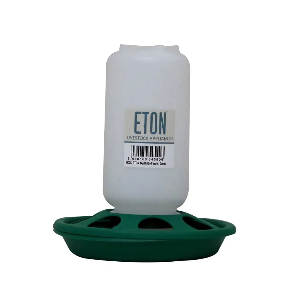 White plastic robust plastic chick feeder with green base and multiple slots for easy feeding eton bottle chick feeder
