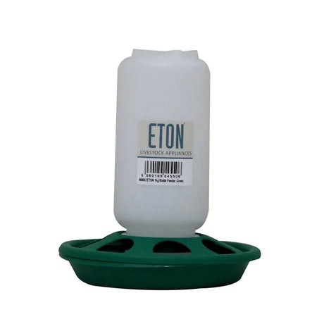 White plastic robust plastic chick feeder with green base and multiple slots for easy feeding eton bottle chick feeder