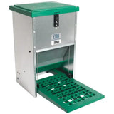 Green and silver metal eton treadle poultry feeder with hinged lid, perforated tray, locking mechanism, and quiet treadle action