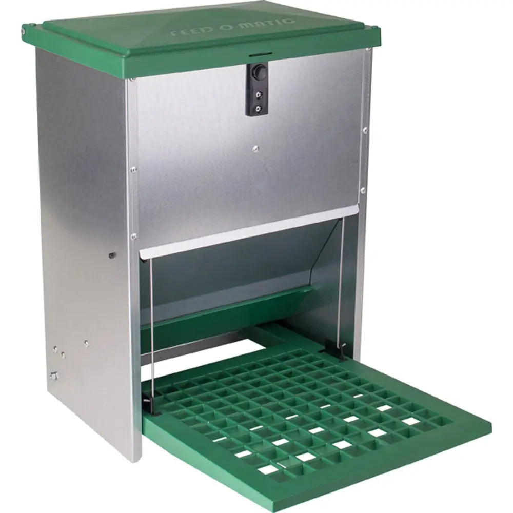 Green and stainless steel eton treadle poultry feeder with hinged lid, locking mechanism, and quiet treadle action tray