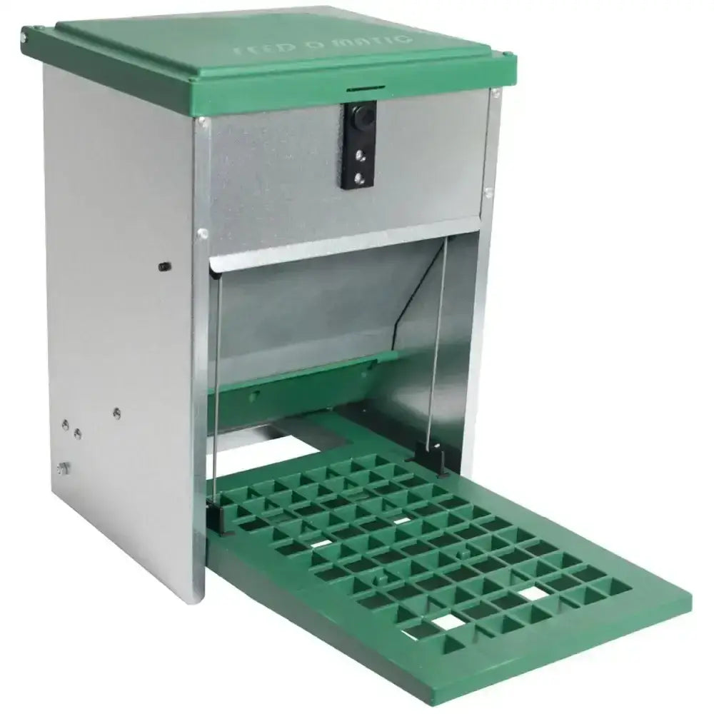 Green and stainless steel eton treadle poultry feeder with hinged access panel and quiet treadle action for easy feeding