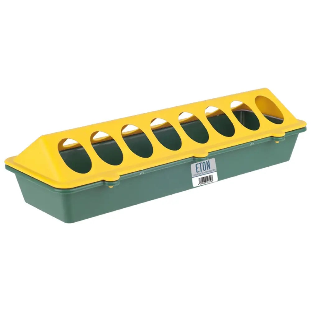 Green and yellow plastic trough feeder made with eight oval openings for easy chick trough poultry feeding