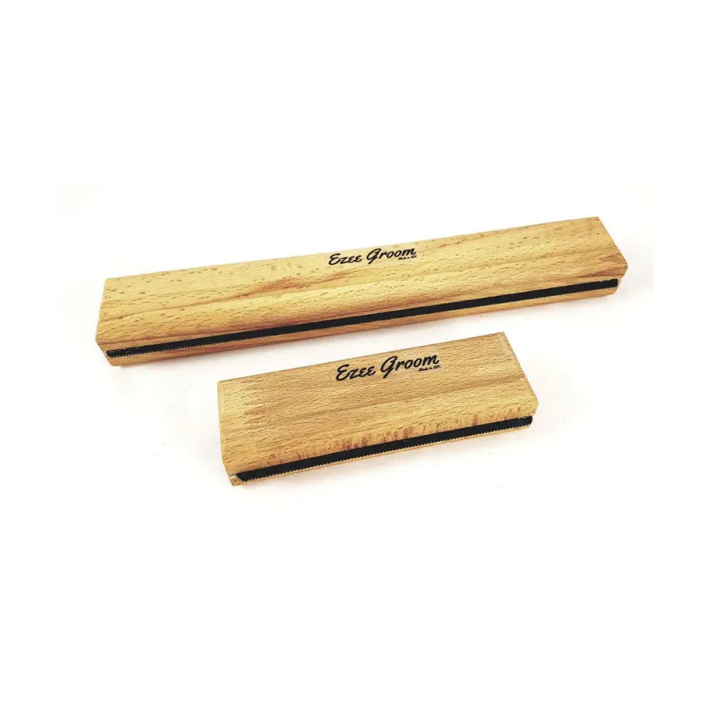 Two wooden ezee groom grooming brushes with natural wood grain and black rubber edges as indispensable shedding tool