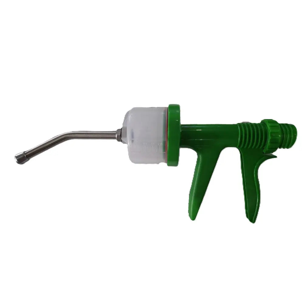 Green plastic-handled veterinary drencher with translucent barrel and stainless steel nozzle for equestrian horses