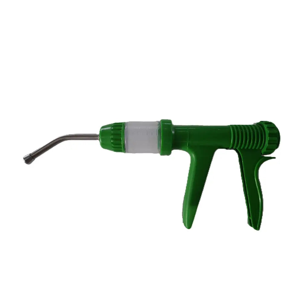 Green plastic veterinary drencher syringe with clear barrel and metal nozzle for equestrian use on horses