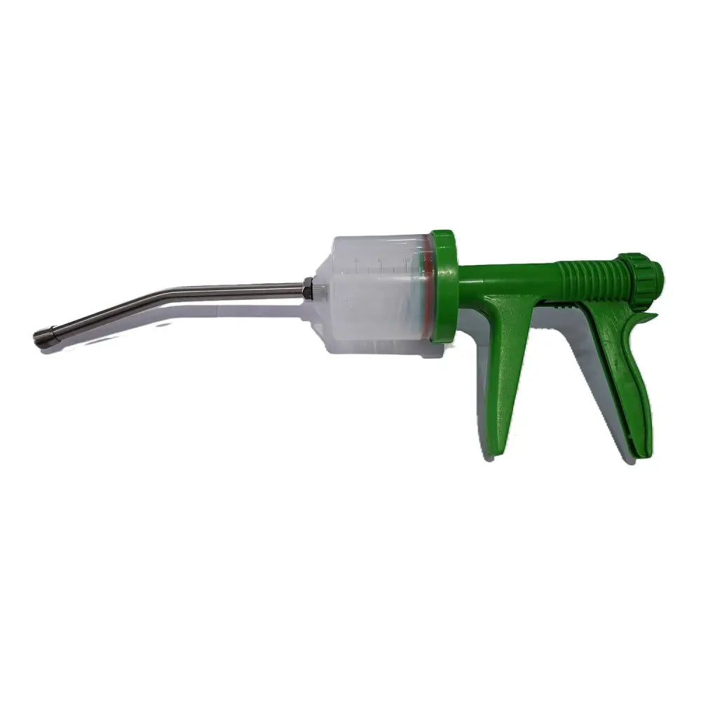 Green plastic-handled veterinary drencher syringe with clear barrel and metallic needle for equestrian horses use