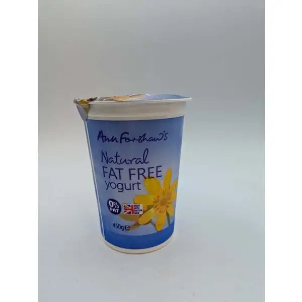 A blue plastic cup of ann forshaws natural fat free yogurt with yellow flower design and 0% fat label farmouse natural yogurt