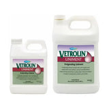 Two white plastic jugs of farnam vetrolin liniment with purple green labels featuring a droplet graphic aromatic embrocation