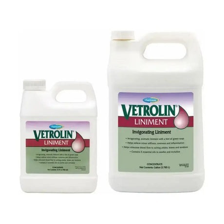 Two white plastic jugs of farnam vetrolin liniment with purple green labels featuring a droplet graphic aromatic embrocation