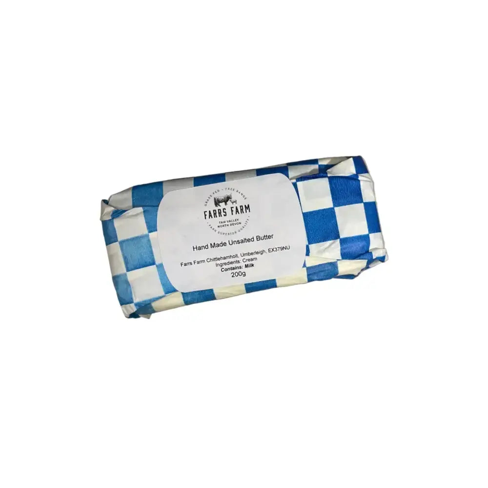 A 200g package of fars farm hand-made unsalted farrs farm butter wrapped in blue and white checkered paper