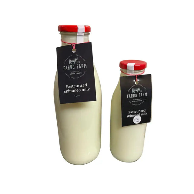 Two glass bottles of farrs farm pasteurised skimmed milk with red caps and black labels, 1 litre and 500ml sizes