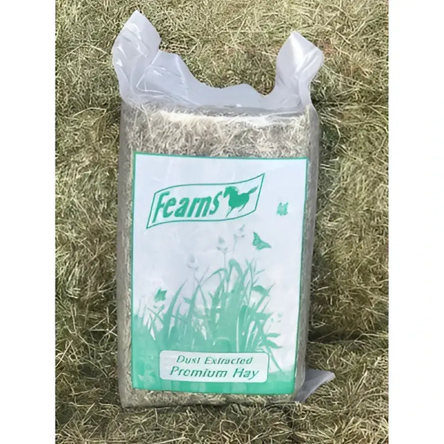 A bag of fearns farm premium hay with green and white label featuring horse logo and timothy rye grass mix