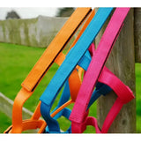 Brightly colored nylon field safe headcollar rhinegold in orange blue and pink with touch tape adjustable headpiece