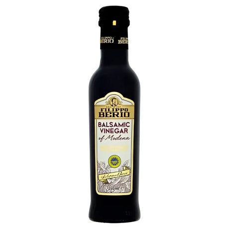 A dark glass bottle of filippo berio balsamic vinegar 250ml with a gold and white label in elegant script