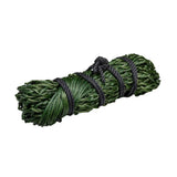 A tightly bound bundle of dark green textured fibers secured with black cord in firefoot economy haynet green
