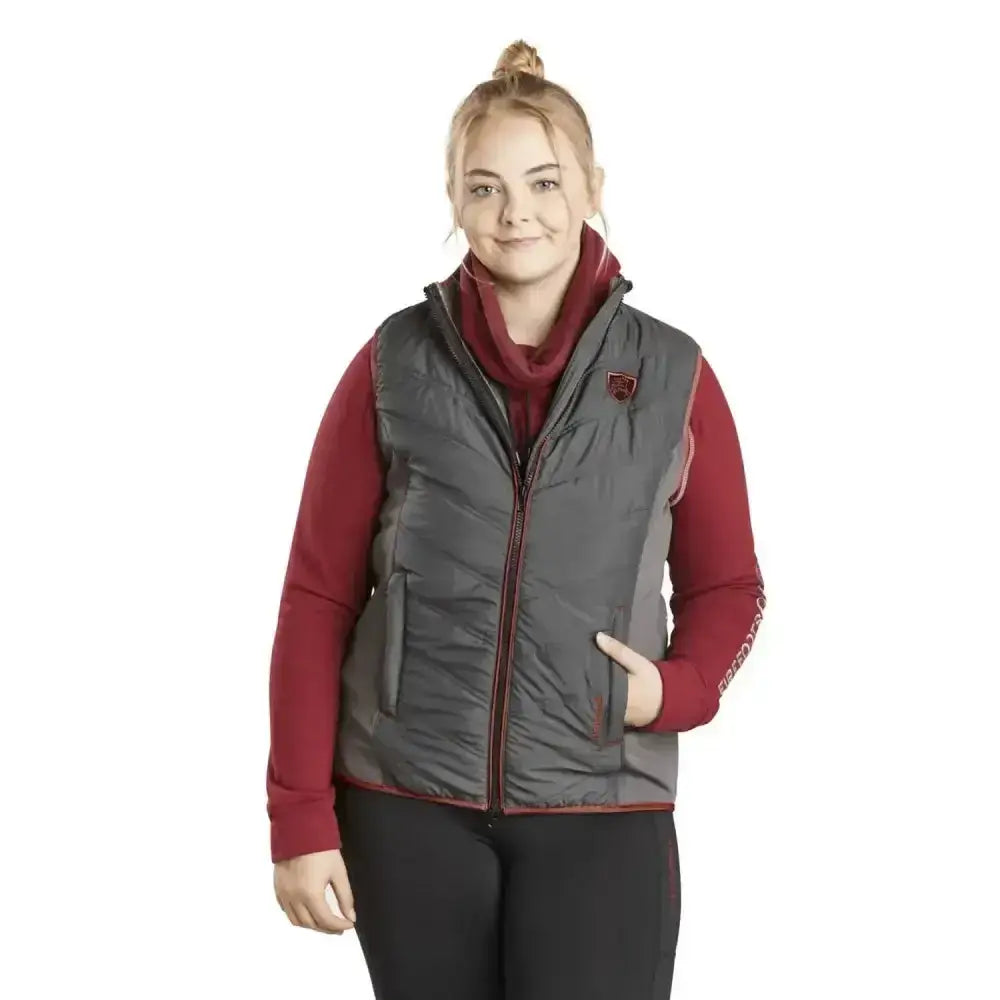 Firefoot gilet ladies grey merlot quilted vest with red trim and logo worn over matching red long-sleeved shirt
