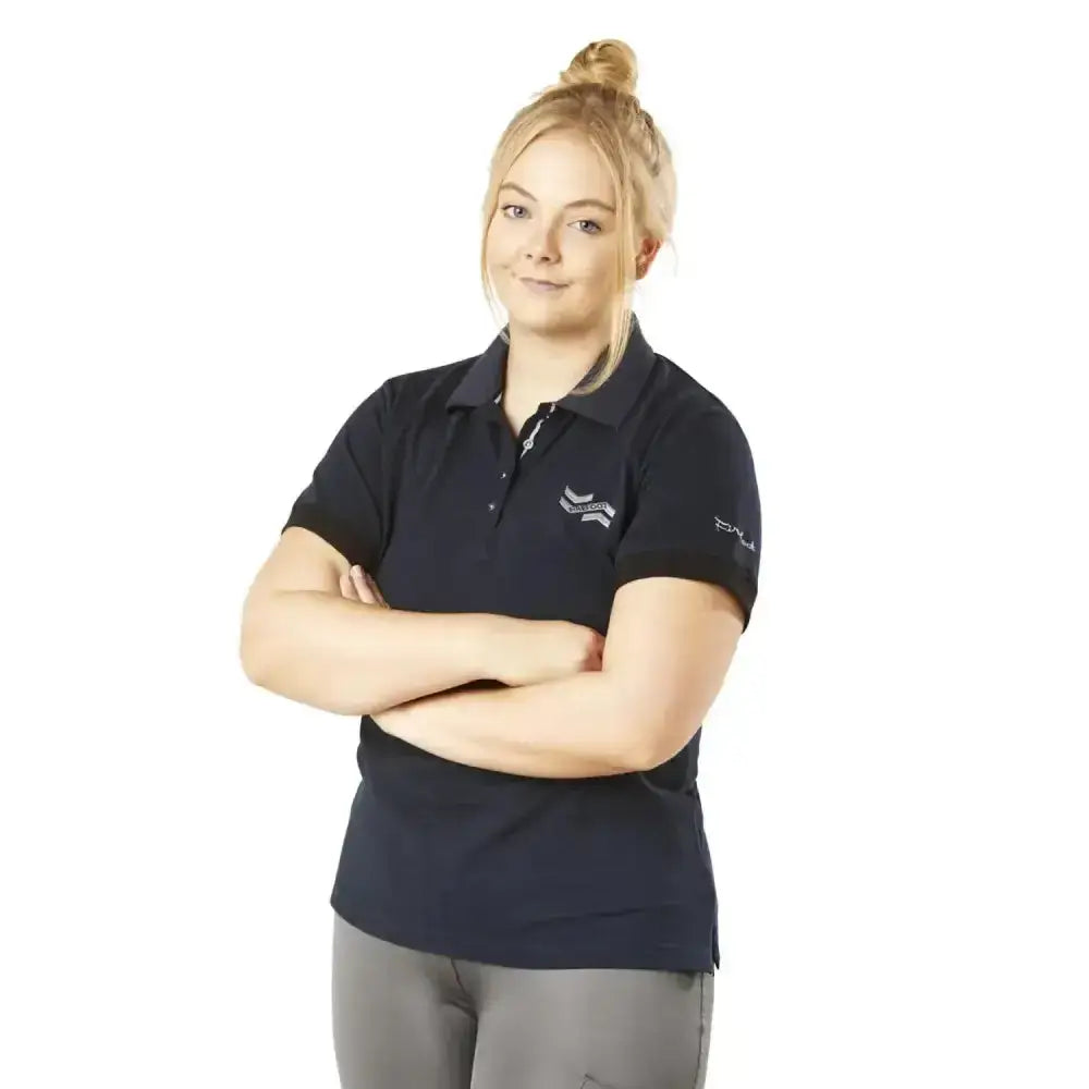 Navy blue firefoot roxby basic polo shirt for ladies with white embroidered logo and brand name on sleeve in navy silver