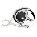 Silver and black retractable dog leash with flexi brand logo featuring comfort tape black and perfected tape guidance