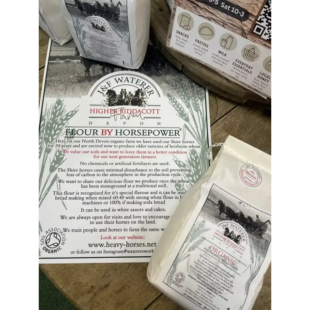 White paper bag of horsepower organic ancient grain stoneground organic flour labeled higher biddacott devon flour