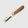 Folding thinning knife with wooden handle, brass ferrule, and stainless steel blade with fine teeth for mane and tail care