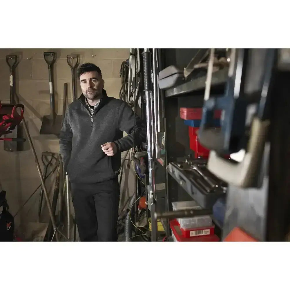 Man wearing a hardwearing knitted marl fort easton pullover grey quarter-zip fleece jacket